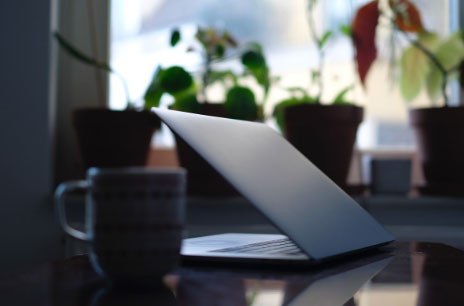 Half closed laptop on desk