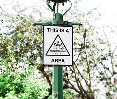 Neighbourhood watch area sign on streetlamp 