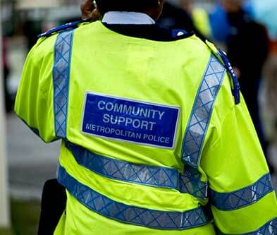 Back torso shot of met police community support officer